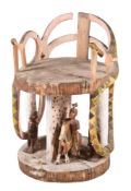 A CARVED AND PAINTED WOOD CEREMONIAL CHAIR