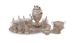 AN ARABIC SILVER COLOURED COFFEE SET
