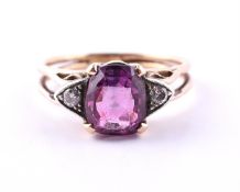 A PINK SAPPHIRE AND DIAMOND THREE STONE RING