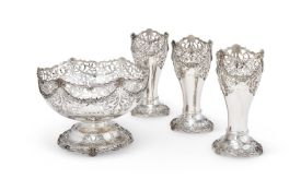 A SILVER SHAPED CIRCULAR PIERCED PEDESTAL ROSE BOWL AND THREE VASES