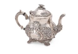 A CONTINENTAL SILVER COLOURED BALUSTER TEA POT