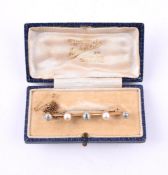 A DIAMOND AND PEARL SET BAR BROOCH, CIRCA 1910 AND LATER