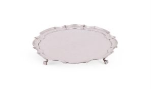 A SILVER SHAPED CIRCULAR SALVER