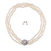 A THREE ROW CULTURED PEARL NECKLACE WITH DIAMOND AND PEARL CLASP