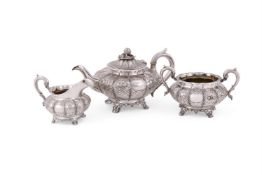 Y A VICTORIAN MATCHED SILVER THREE PIECE LOBED CIRCULAR TEA SET