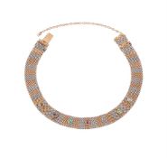 A TWO COLOUR WOVEN LINK DEAREST BRACELET, CIRCA 1910