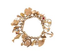 A GOLD COLOURED CHARM BRACELET