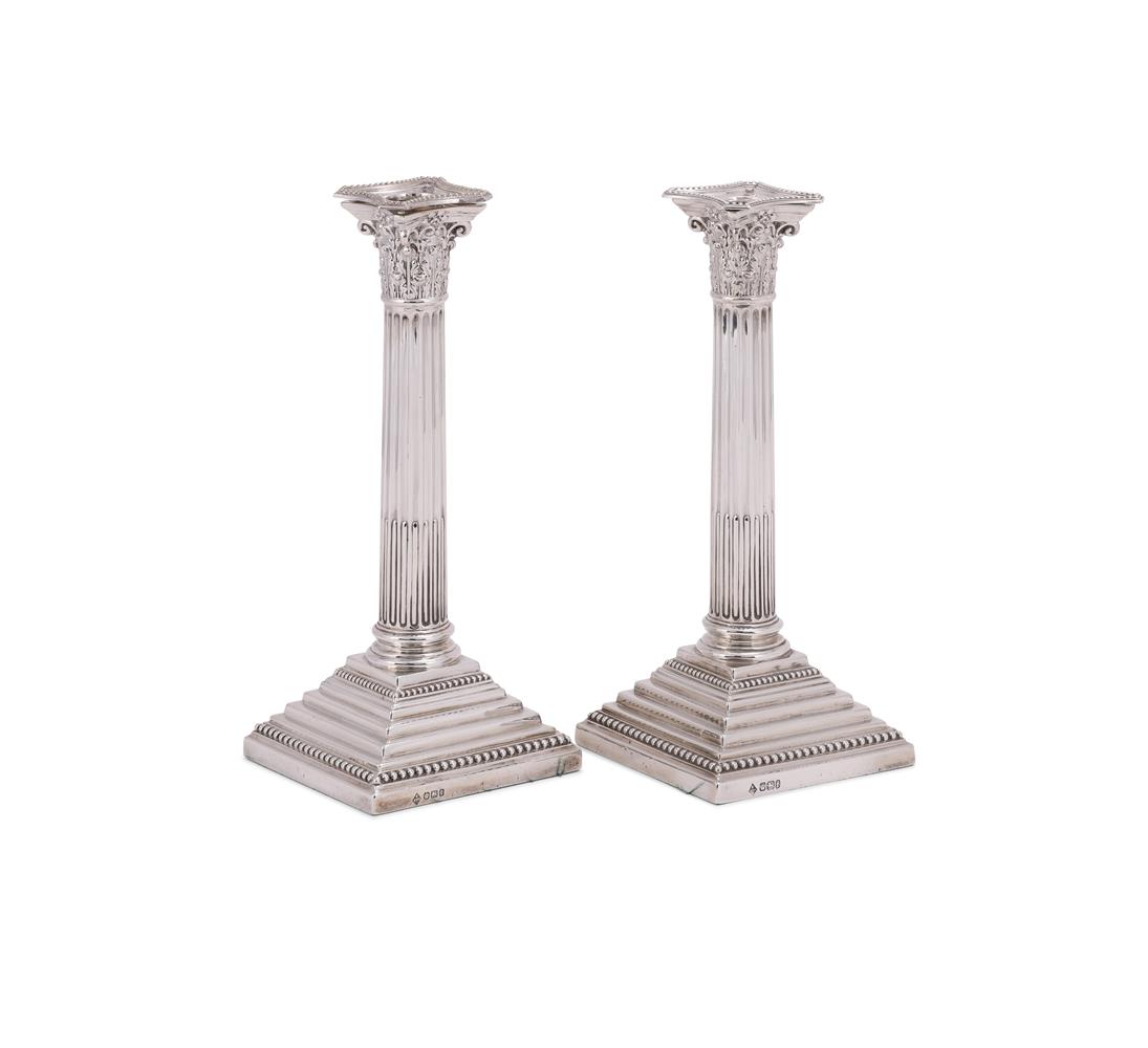 A PAIR OF VICTORIAN SILVER CORINTHIAN CANDLESTICKS
