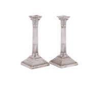 A PAIR OF VICTORIAN SILVER CORINTHIAN CANDLESTICKS