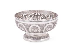 AN INDIAN SILVER COLOURED PEDESTAL BOWL