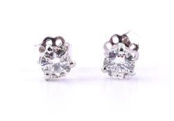 A PAIR OF DIAMOND SINGLE STONE EAR STUDS