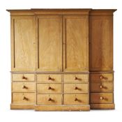 AN ENGLISH PAINTED GRAINED BREAKFRONT WARDROBE, EARLY 19TH CENTURY