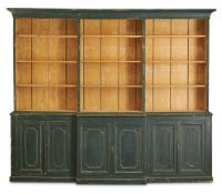 A GEORGE III INDIGO GREEN PAINTED PINE BREAKFRONT BOOKCASE, EARLY 19TH CENTURY