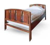 TWO COTSWOLD SCHOOL OAK SINGLE BEDS ATTRIBUTED TO ERNEST GIMSON, EARLY 20TH CENTURY