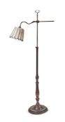 AN EBONISED AND RED PAINTED BRASS STANDARD LAMP, EARLY 20TH CENTURY AND LATER