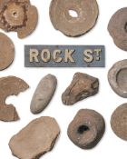 A GROUP OF THIRTEEN ANCIENT MILLSTONES AND ASSOCIATED FRAGMENTS