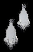 A PAIR OF GLASS FRAMED WALL MIRRORS