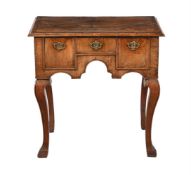 A WALNUT AND FEATHER-BANDED SIDE TABLE