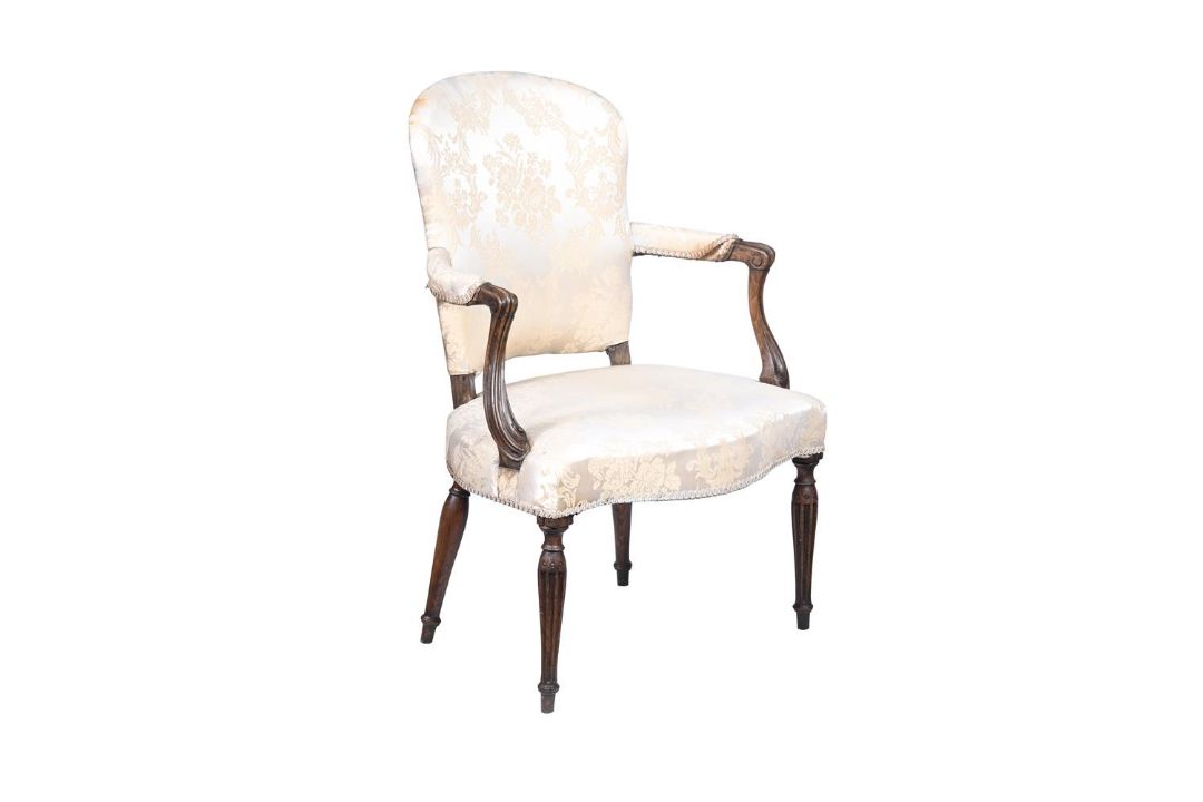 A GEORGE III MAHOGANY AND UPHOLSTERED ARMCHAIR IN FRENCH TASTE