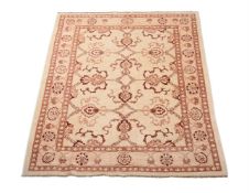 A WOVEN RUG, IN ZIEGLER MAHAL STYLE