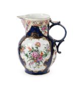 A WORCESTER POLYCHROME PORCELAIN BLUE-SCALE GROUND CABBAGE-LEAF MOULDED MASK JUG