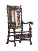 A RARE CHARLES II WALNUT RECLINING ARMCHAIR, CIRCA 1660