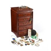 Y A Chinese hardwood chest of drawers containing various items