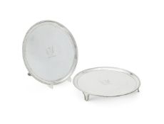 A PAIR OF GEORGE III SILVER CIRCULAR SALVERS