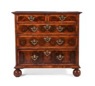 A QUEEN ANNE OLIVEWOOD, WALNUT, FRUITWOOD OYSTER VENEERED AND FEATHER-BANDED CHEST OF DRAWERS