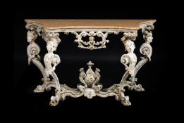 AN ITALIAN BAROQUE CREAM PAINTED CONSOLE TABLE, OF RARE FORM, VENICE, CIRCA 1720
