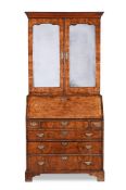 A GEORGE II POLLARD OAK AND CROSS BANDED BUREAU CABINET, CIRCA 1730