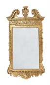 A GEORGE II CARVED GILTWOOD PIER MIRROR, CIRCA 1730