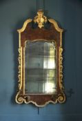 A GEORGE I BURR WALNUT AND PARCEL GILT GIRANDOLE MIRROR, CIRCA 1720
