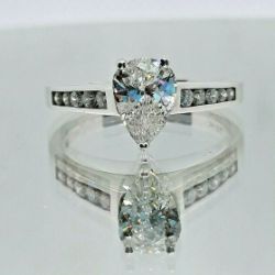 1.01 CARAT PEAR DIAMOND ENGAGEMENT RING/ 0.18 KARAT DIAMOND SHOULDERS
