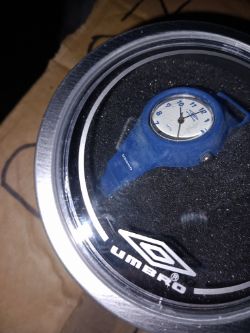 UMBRO ASSORTED WATCHES AND TIN APROX 40