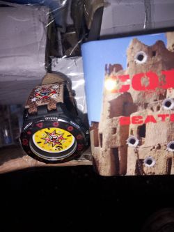 WATCH WITH CASE APROX 70