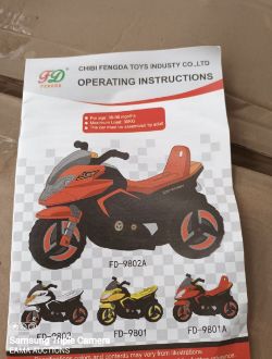 A BRAND NEW BOXED ELECTRIC LIGHT UP MUSICAL CHILDS MOTORCYCLE