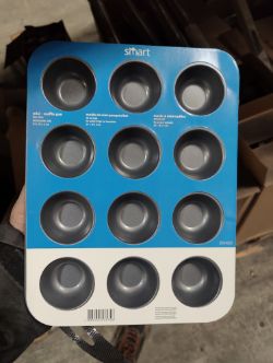 PALLET CONTAINING APPROX 100 MINI MUFFIN OVEN TRAYS AND AROUND 100 ROLLS OF WALLPAPER