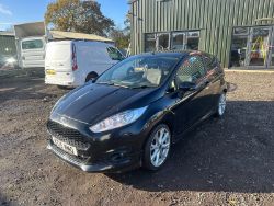 SLEEK BLACK FORD FIESTA VAN: RELIABLE WORKHORSE