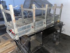 Stainless Steel Mobile Storage unit with 1900 x 600 x1000 and a Length of Concertina Roller Conveyor