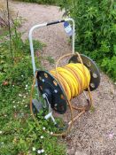 Hose reel trolley and spraying attachment