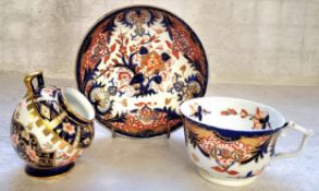 A Royal Crown Derby 1299 pattern small salt pig 9cms high, c.1905; a Royal Crown Derby teacup &