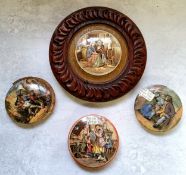 A Prattware pot lid titled The Wolf and The Lamb in a decorative oak frame; others titled