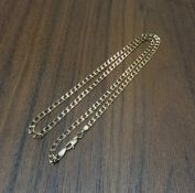 A 9ct gold diamond cut curb 21