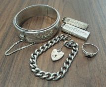 A silver ingot pendant, Carrs, Sheffield, 1977, 30g; another 15.6g; a silver curb/charm bracelet,