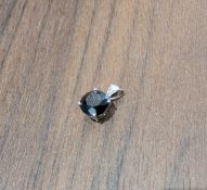 A 14ct white gold solitaire pendant, claw set with an approx. 2ct 'black' diamond