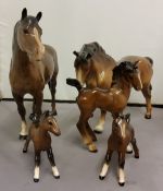 A Beswick bay mare, off fore raised, 15.5cm high;  another;  a Beswick foal;  others, Royal