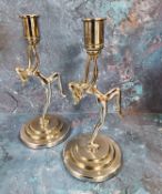 A pair of Art Deco chrome plated figural candlesticks, cast with naked ladies, 19cm high, c.1930.