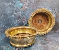 A pair of 19th century silver plated bottle coasters, draught turned bases, gadrooned and shell