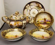 A Noritake two-handled tureen, cover and stand, decorated with landscapes in gilt cartouches on a